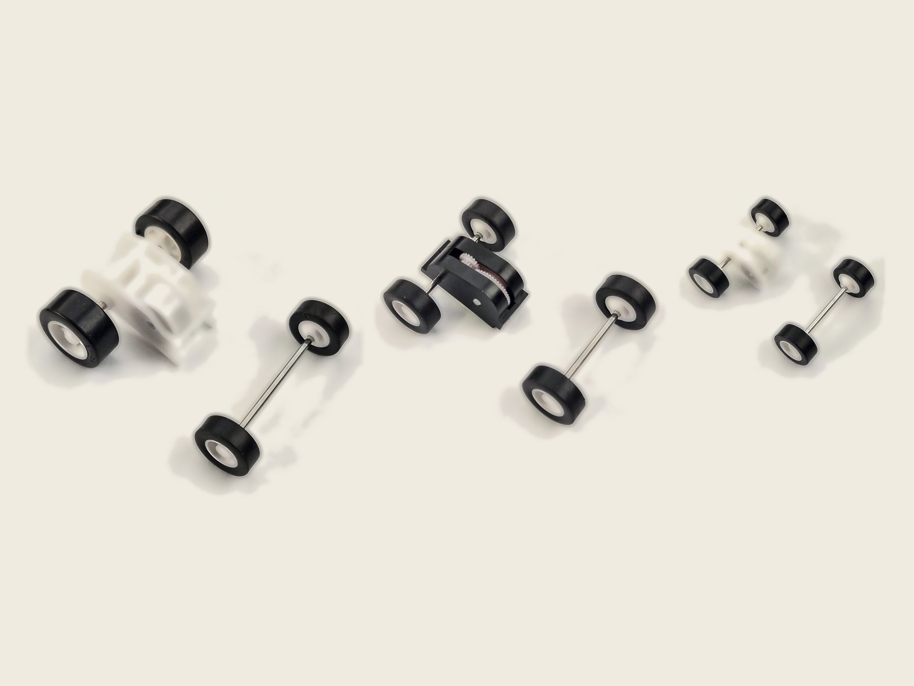 One Brute, one Scamp and one Skimp pull-back motor with their matching front wheel-and-axle sets